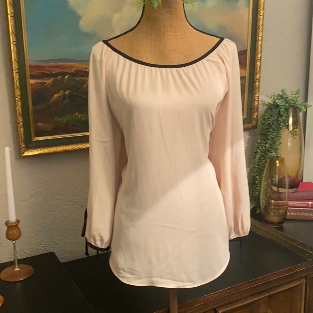Blush and black blouse